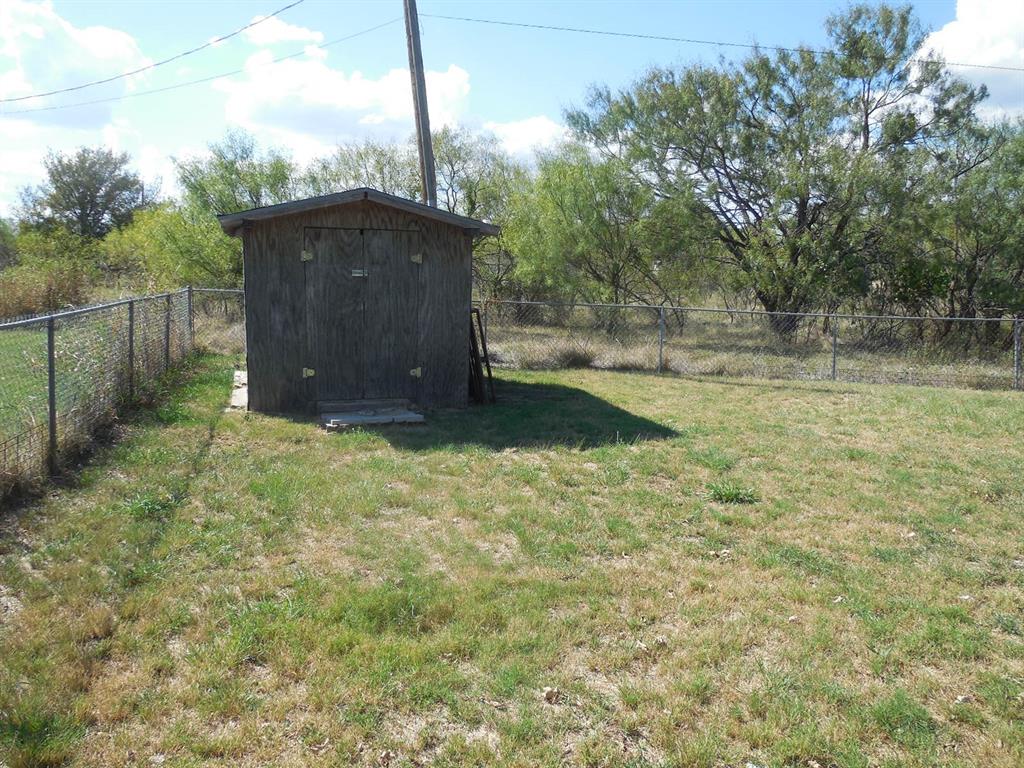 1220 Meadowbrook Street Ranger, TX 76470 - Photo 21 of 28 a backyard of a house