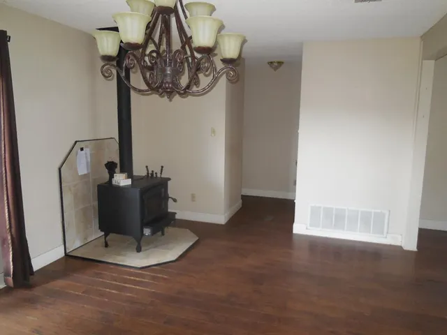 a kitchen with stainless steel appliances granite countertop a stove a refrigerator and a oven