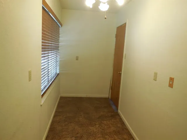 a bathroom with a sink mirror and toilet