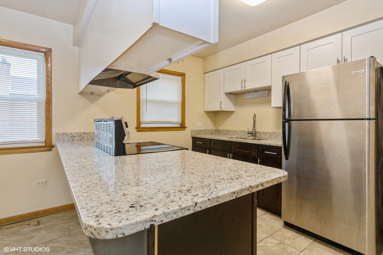 4434 West 87th Street, Unit 1E Chicago, IL 60652 - Photo 3 of 8 a kitchen with refrigerator and window