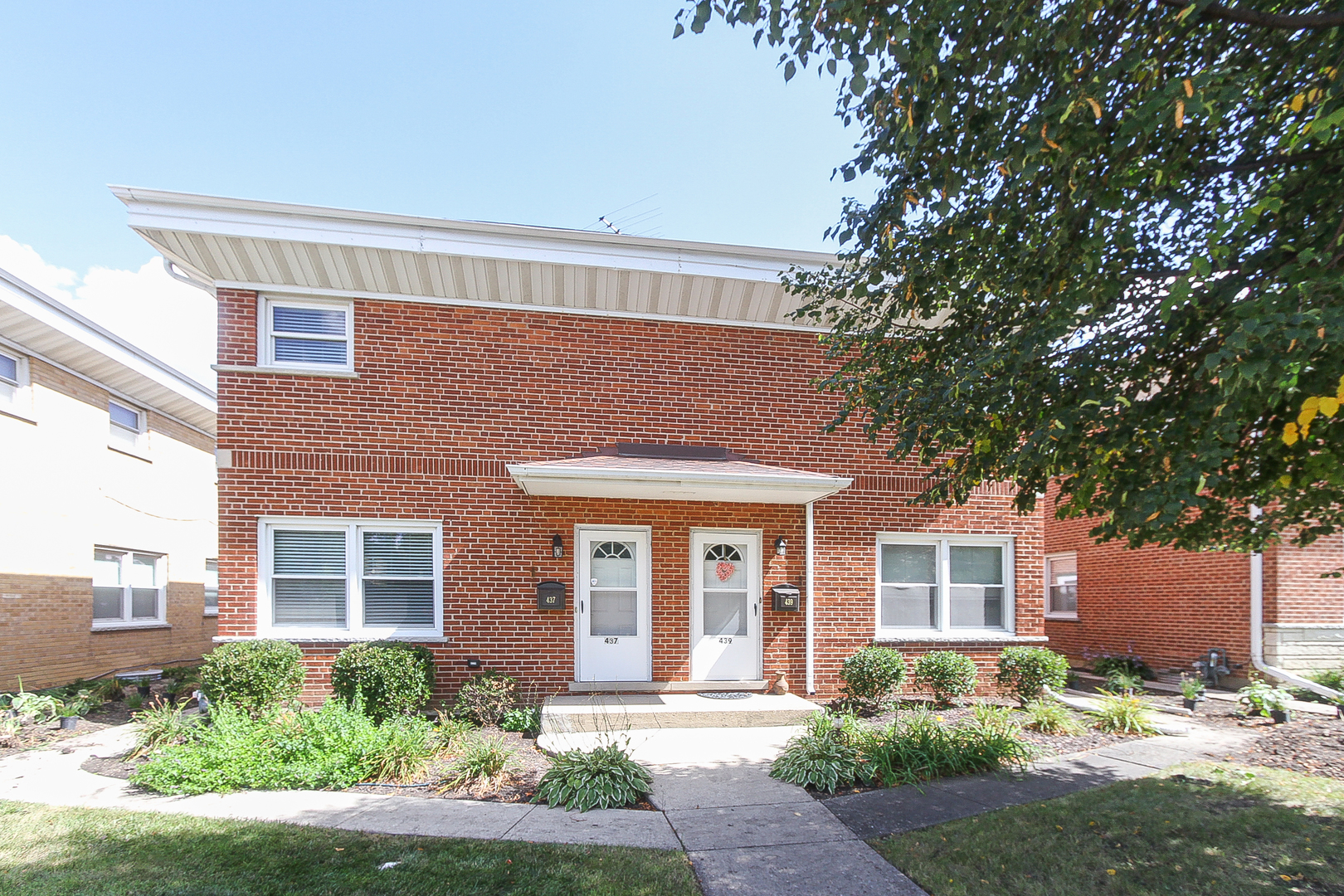 439 Elmhurst Road Mount Prospect, IL 60056 - Photo 1 of 24 front view of a house with a yard
