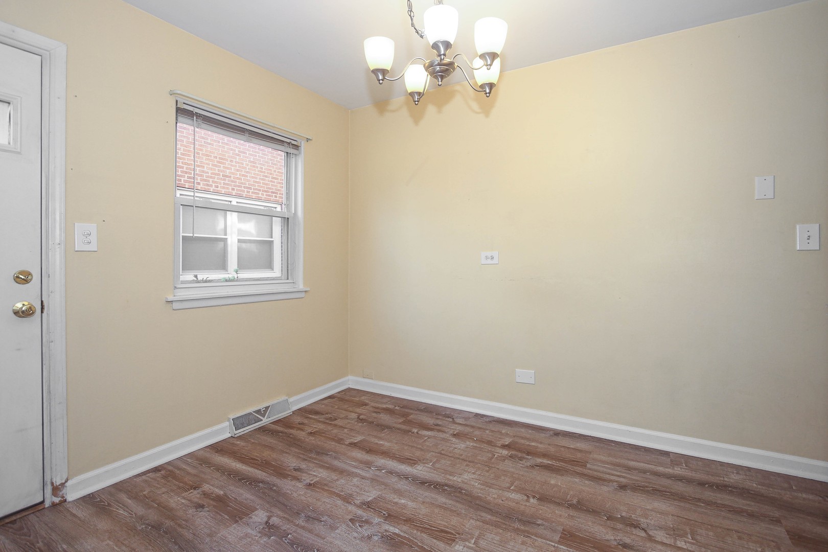 439 Elmhurst Road Mount Prospect, IL 60056 - Photo 10 of 24 wooden floor in an empty room