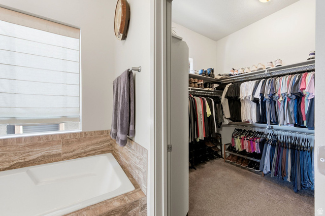 987 East Deer Arch Lane Draper, UT 84020 - Photo 27 of 46 Primary walk-in closet featuring light colored carpet