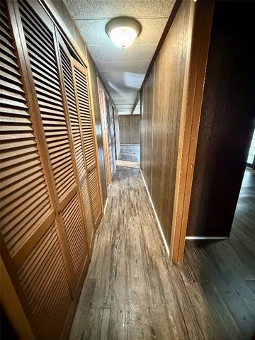 a view of gallery with wooden floor