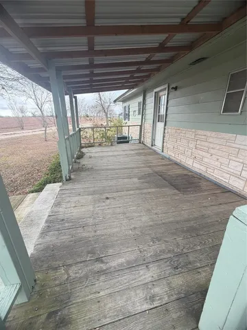 a view of a backyard of the house