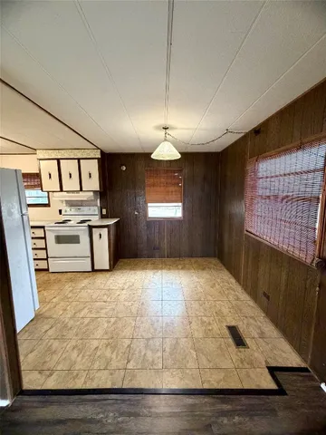 a view of a kitchen with a stove cabinets and a wooden floor