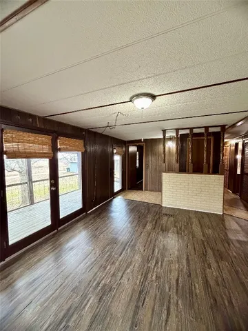 a view of gallery with wooden floor