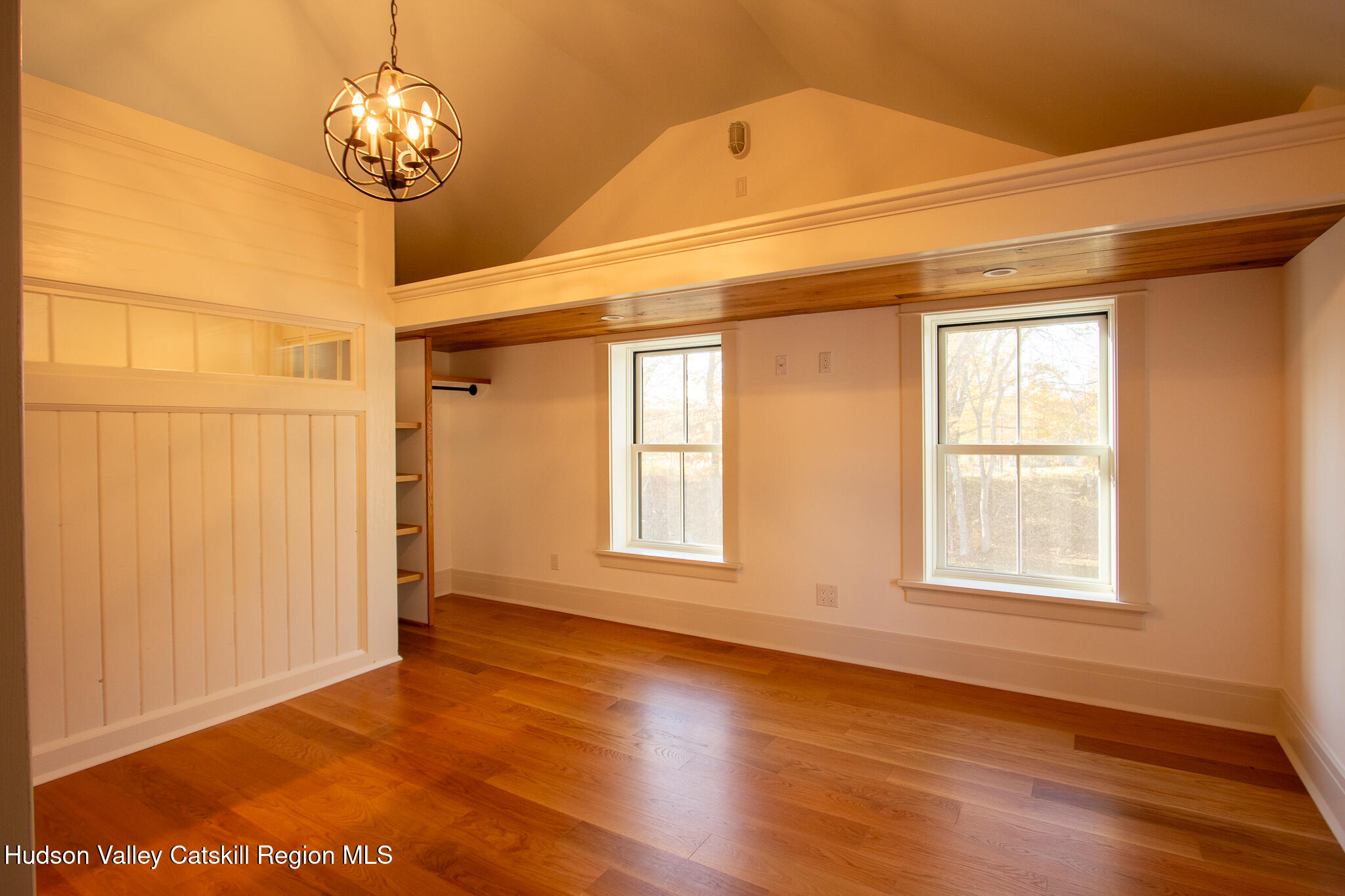 48 Konig Road Ghent, NY 12075 - Photo 15 of 21 a view of a livingroom with a large window wooden floor and chandelier