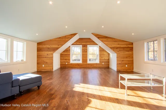 a view of livingroom with furniture wooden floor and windows