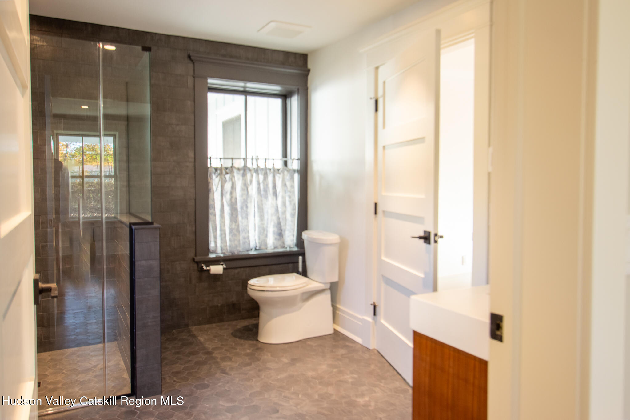 48 Konig Road Ghent, NY 12075 - Photo 8 of 21 a bathroom with a toilet a sink and shower