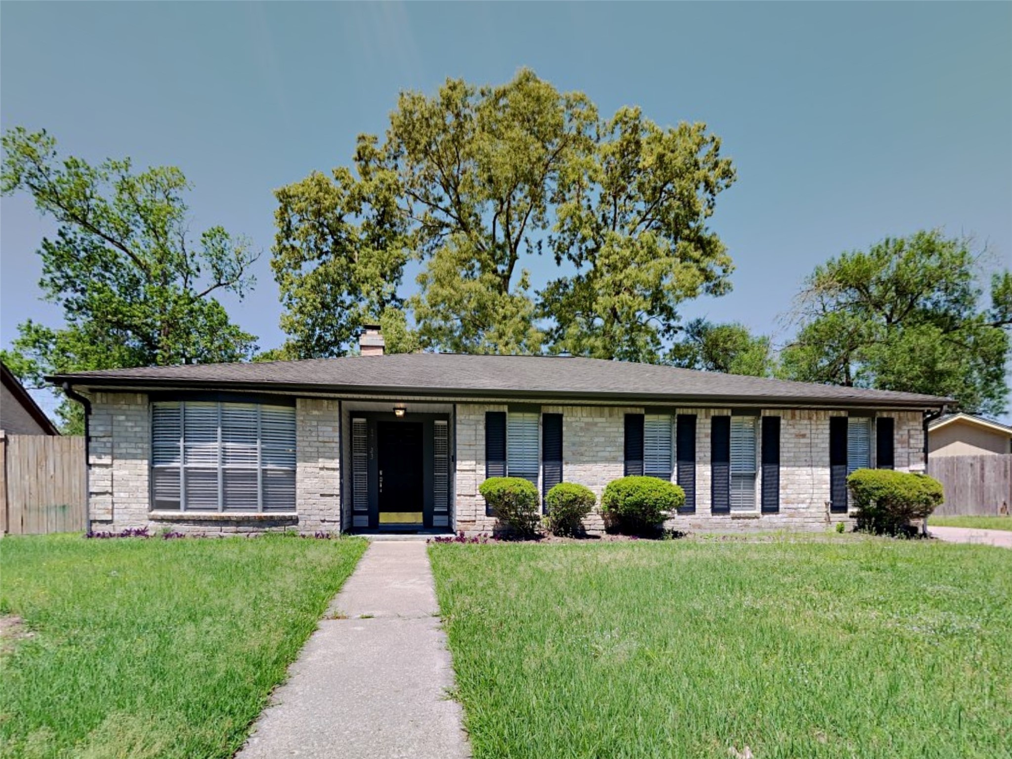 a view of a house with a yard and plants