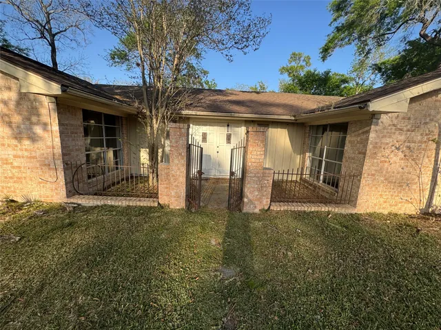 a front view of a house with a big yard