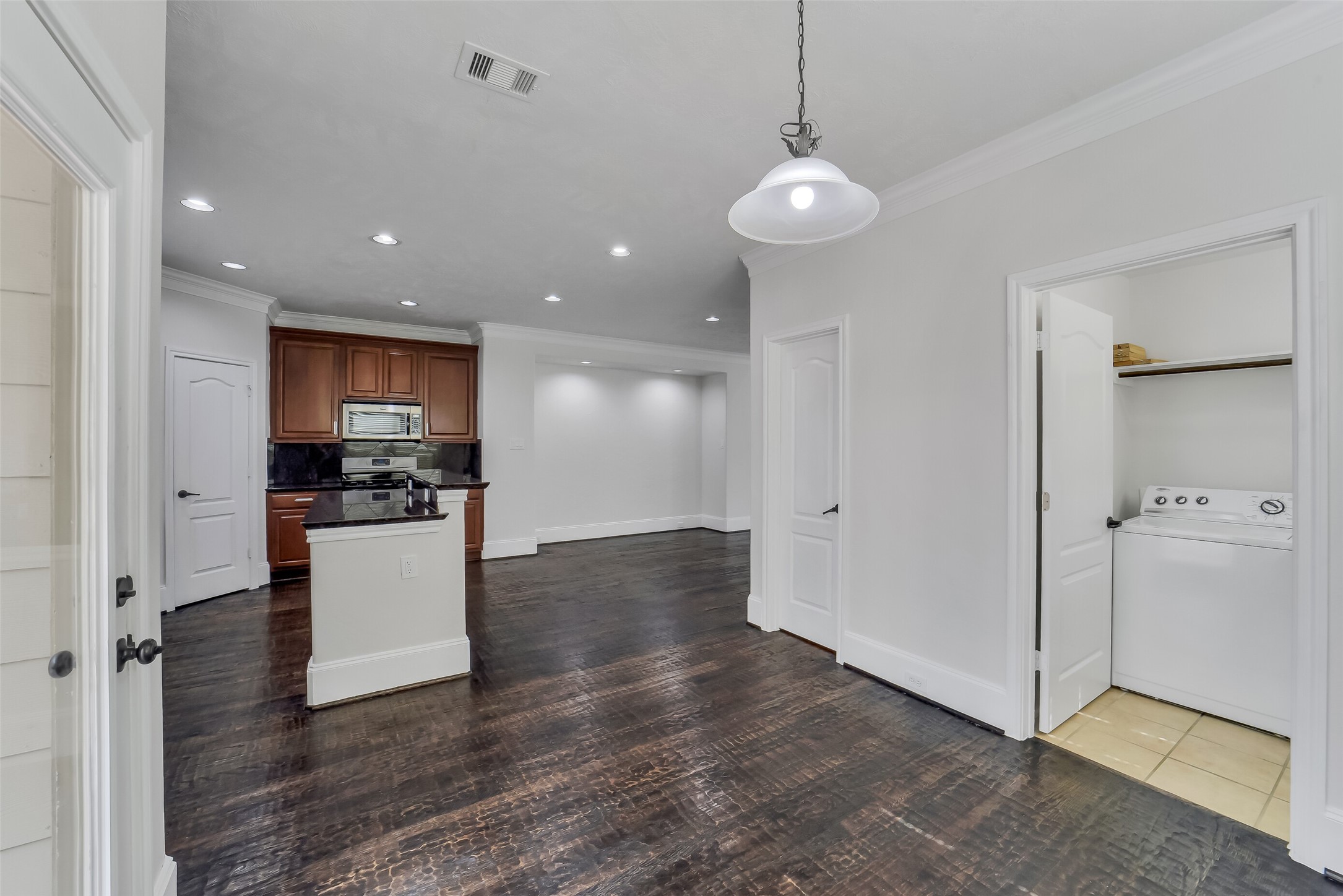 1335 Studer Street Houston, TX 77007 - Photo 16 of 37 a view of open kitchen with white cabinets and refrigerator
