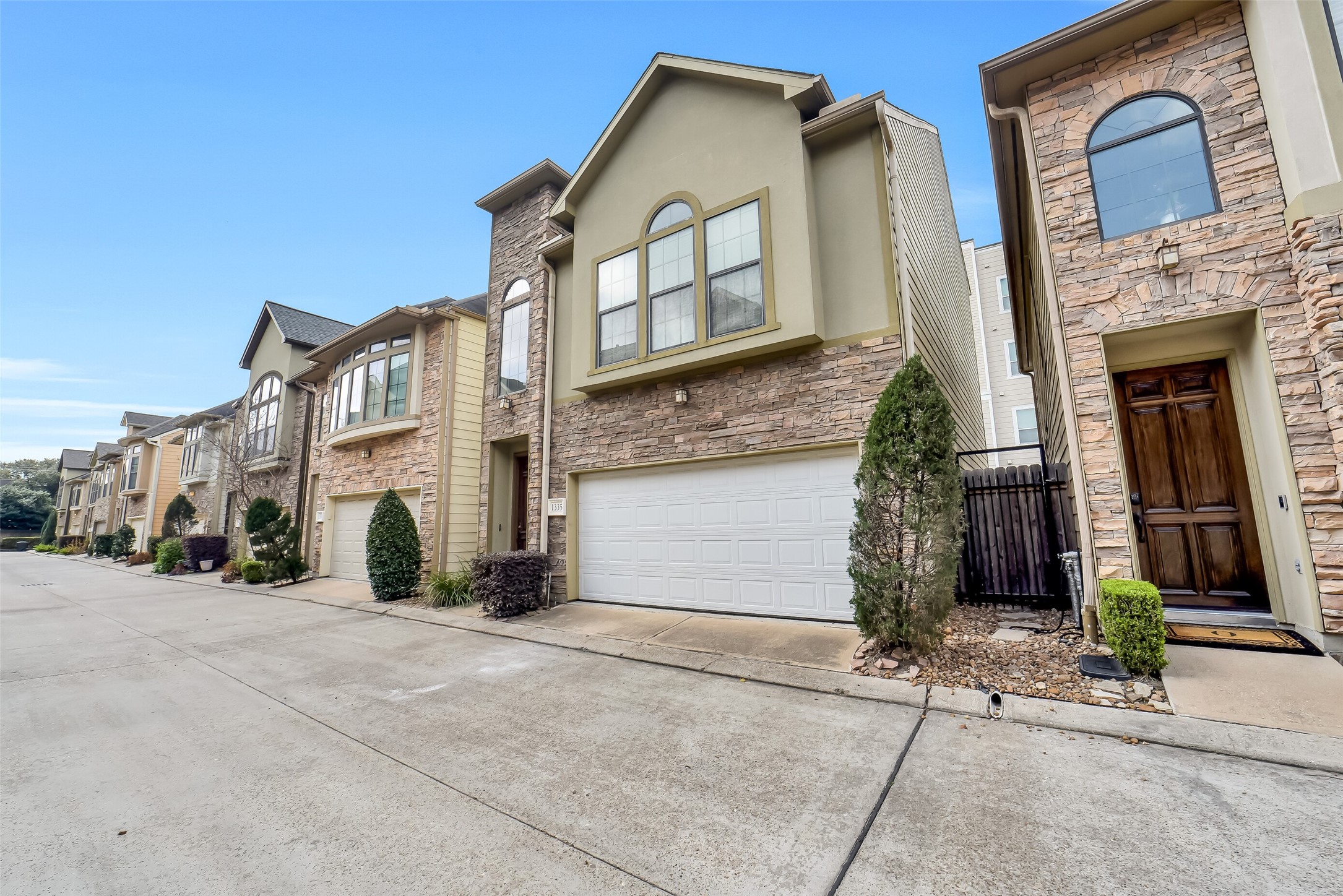 1335 Studer Street Houston, TX 77007 - Photo 2 of 37 a view of a building with a yard