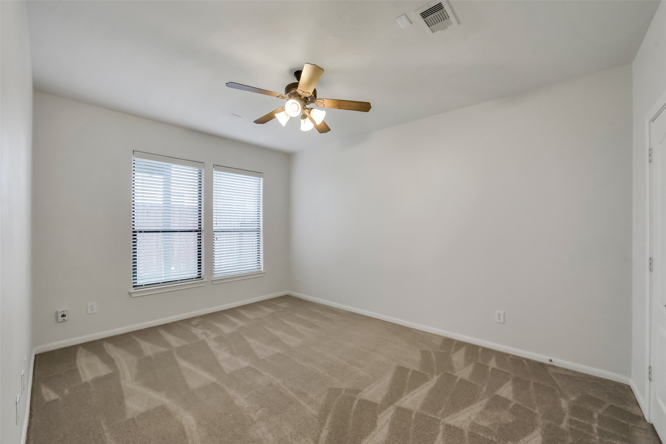 1335 Studer Street Houston, TX 77007 - Photo 27 of 37 wooden floor in an empty room with a window