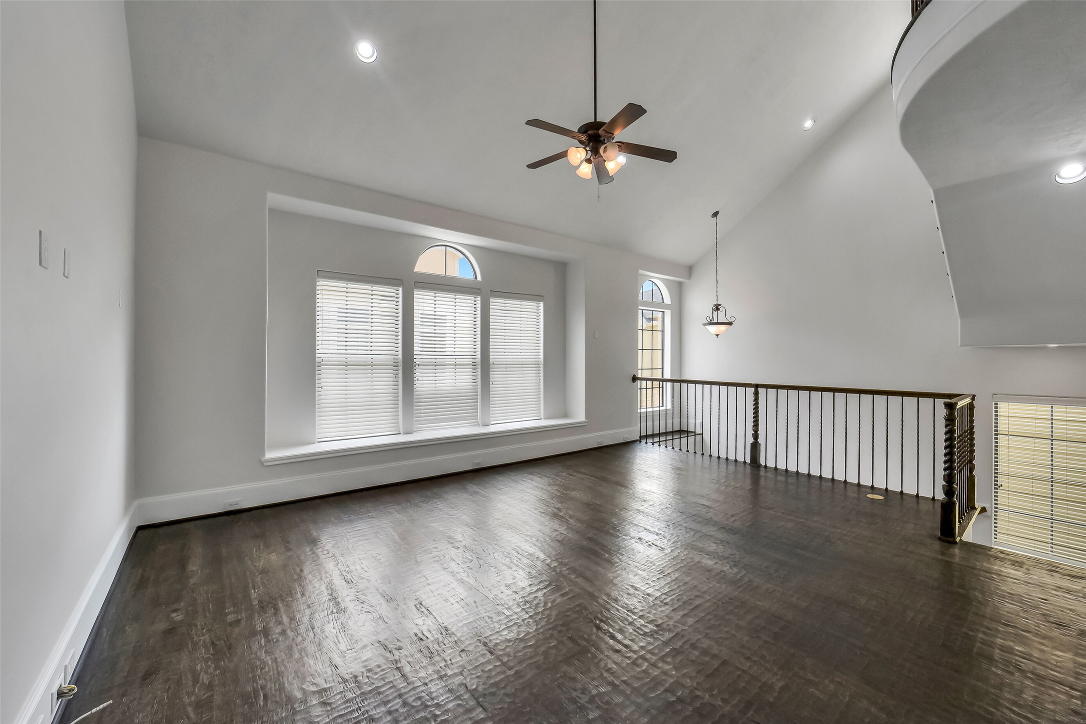 1335 Studer Street Houston, TX 77007 - Photo 9 of 37 a view of an empty room with wooden floor and a window