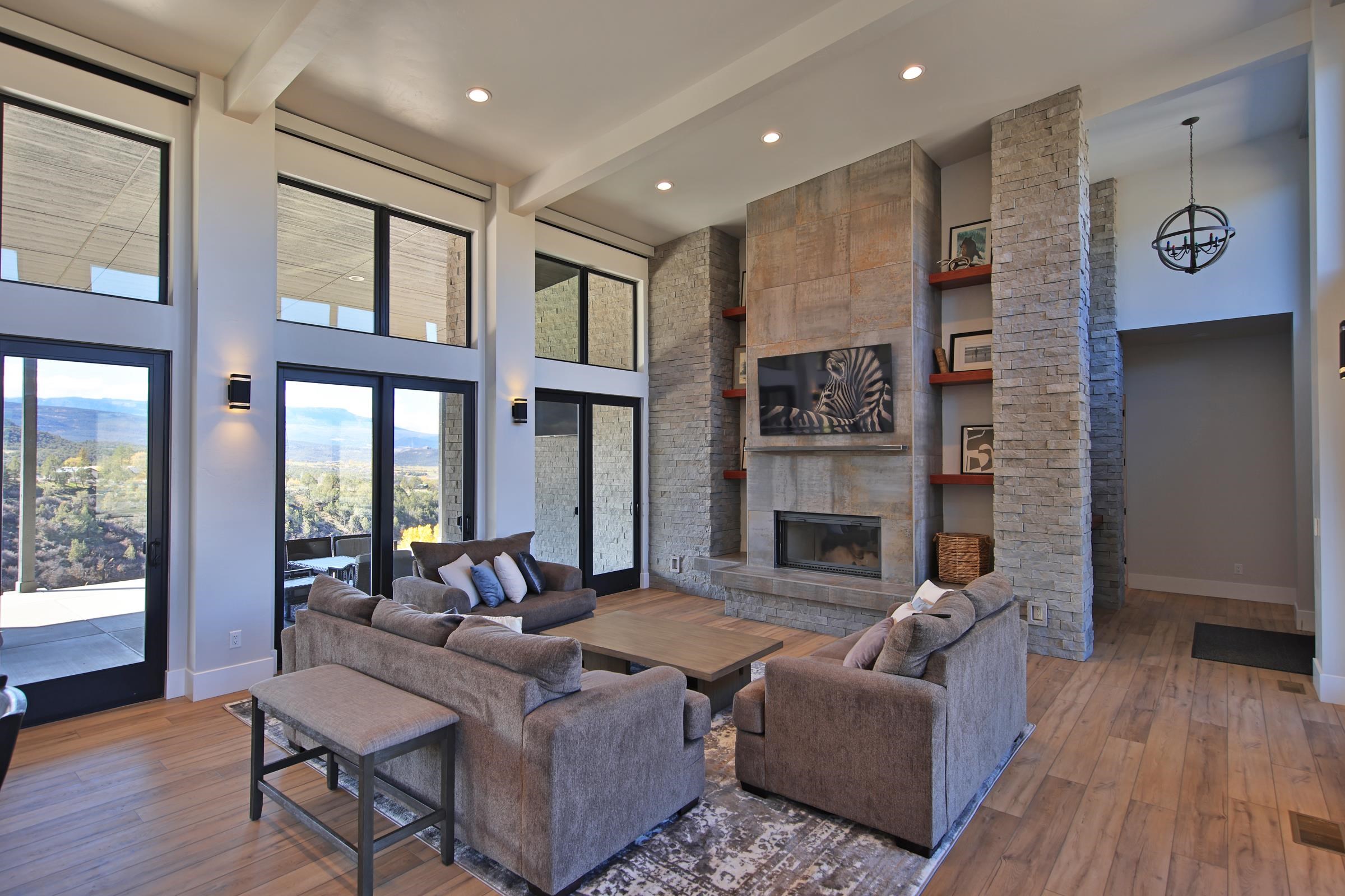 12471-54 54 7/10 Road Molina, CO 81646 - Photo 11 of 39 a living room with furniture large window and wooden floor