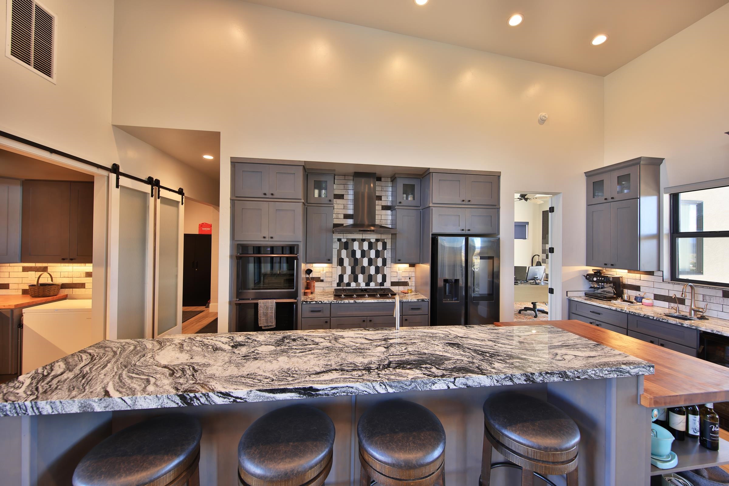 12471-54 54 7/10 Road Molina, CO 81646 - Photo 18 of 39 a kitchen with stainless steel appliances granite countertop a stove refrigerator and cabinets