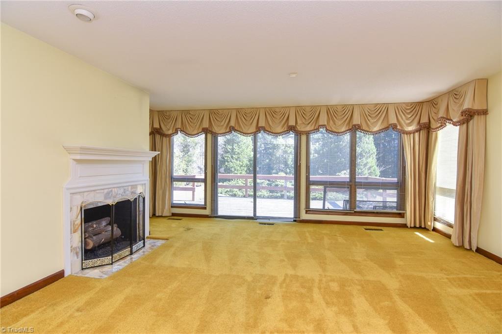 5959 Holder Road Clemmons, NC 27012 - Photo 17 of 40 Living Room with fireplace and access to rear deck