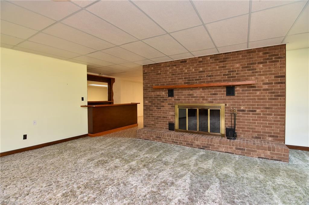 5959 Holder Road Clemmons, NC 27012 - Photo 35 of 40 View of Lower Level Den with wet bar leading into Playroom