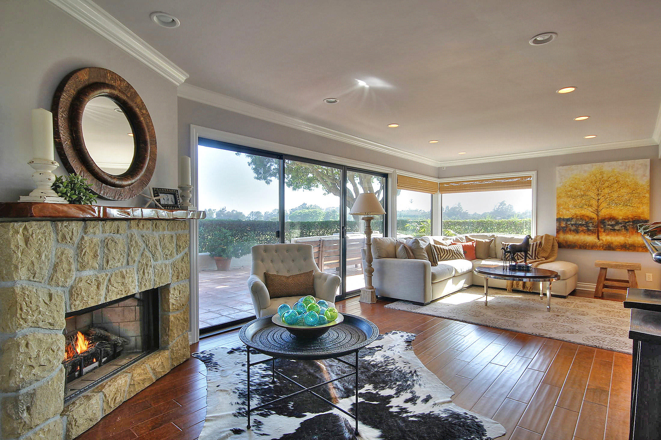 3375 Foothill Road, Unit 1114 AND 1113 Carpinteria, CA 93013 - Photo 4 of 27 a living room with furniture a fireplace a large window and a large window