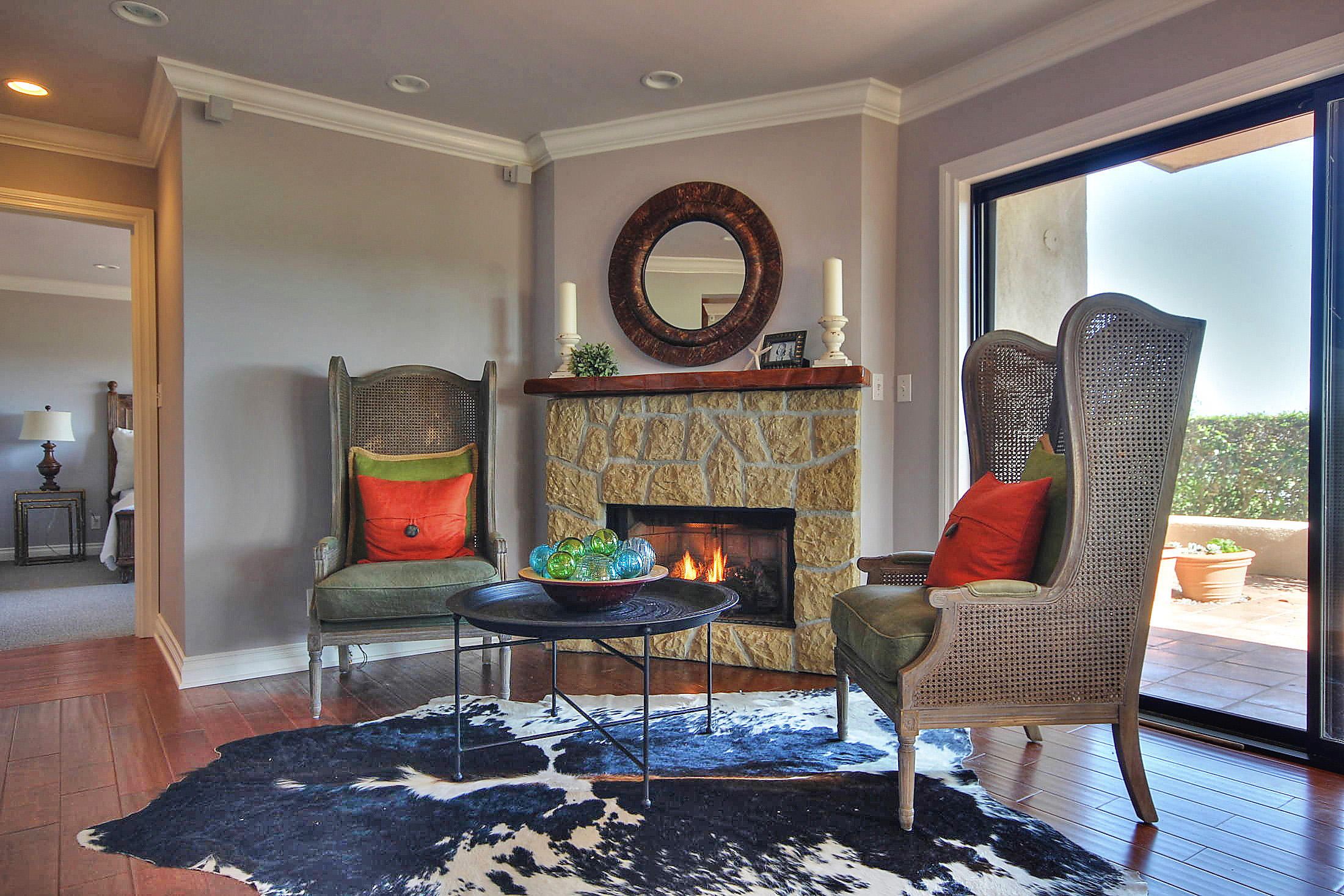3375 Foothill Road, Unit 1114 AND 1113 Carpinteria, CA 93013 - Photo 7 of 27 a living room with furniture a rug and a fireplace