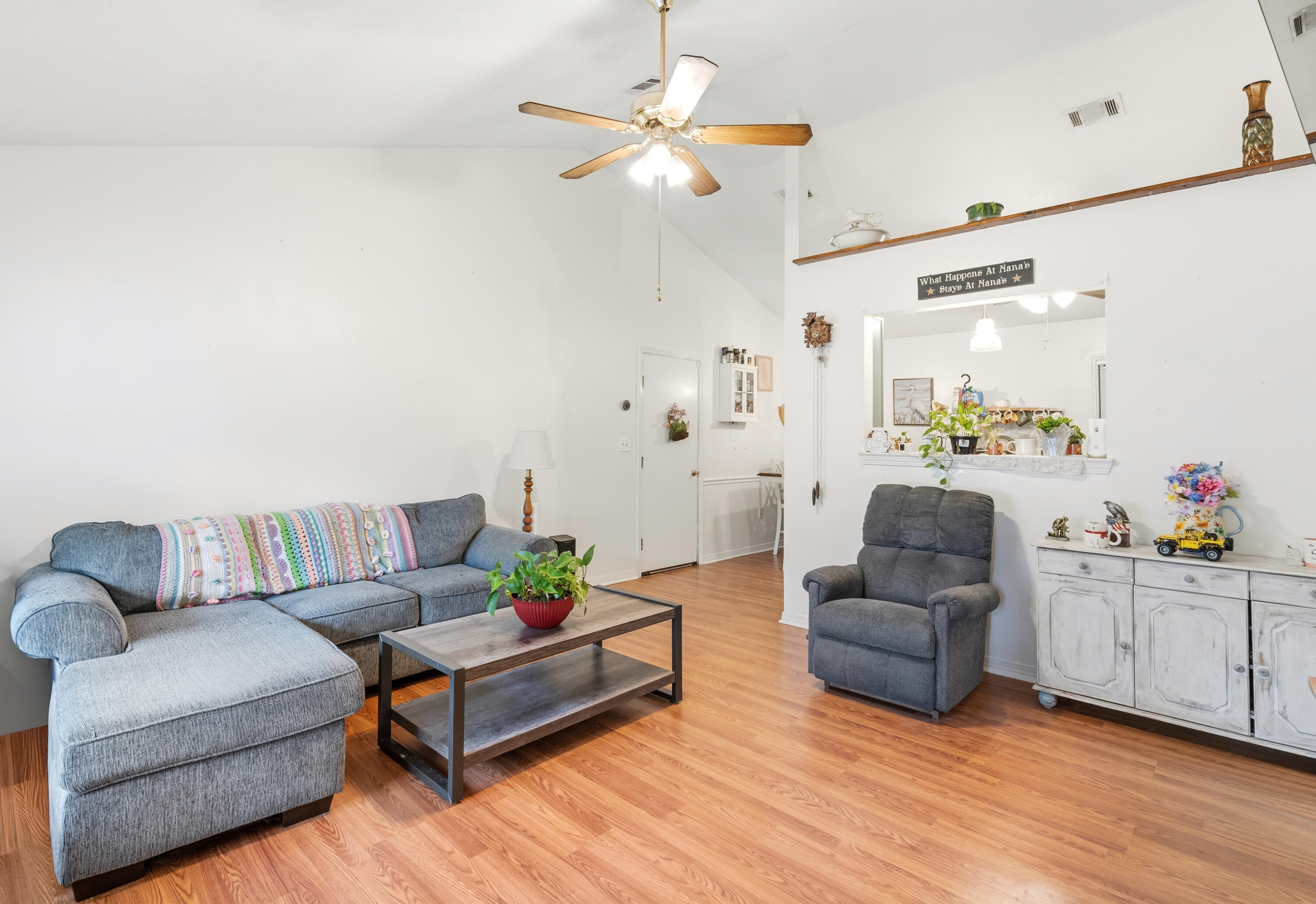 2880 Aplin Road Crestview, FL 32539 - Photo 8 of 33 a living room with furniture and a chandelier
