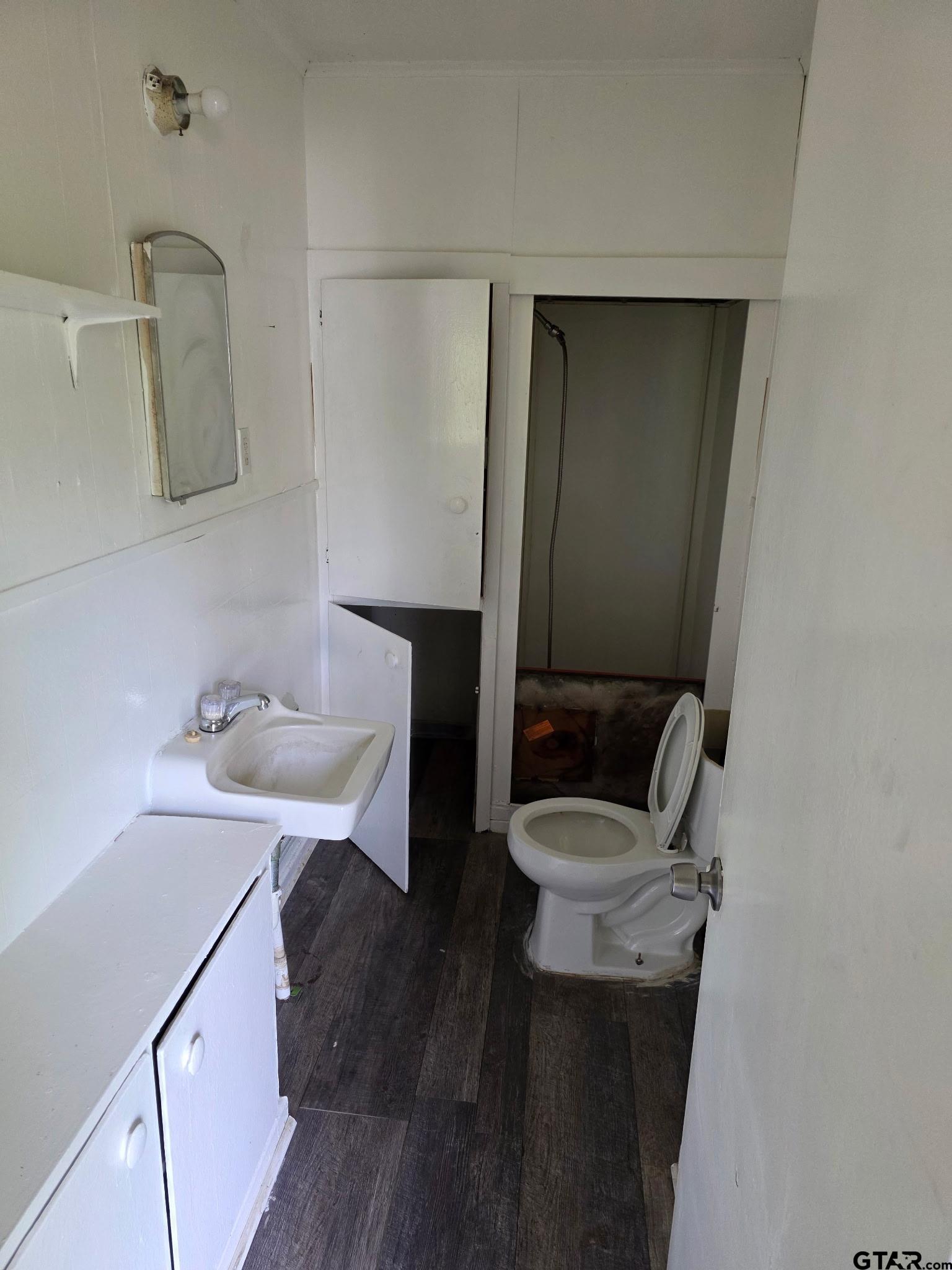 312 5th Street Southwest Bogata, TX 75417 - Photo 6 of 9 a bathroom with a sink and a mirror