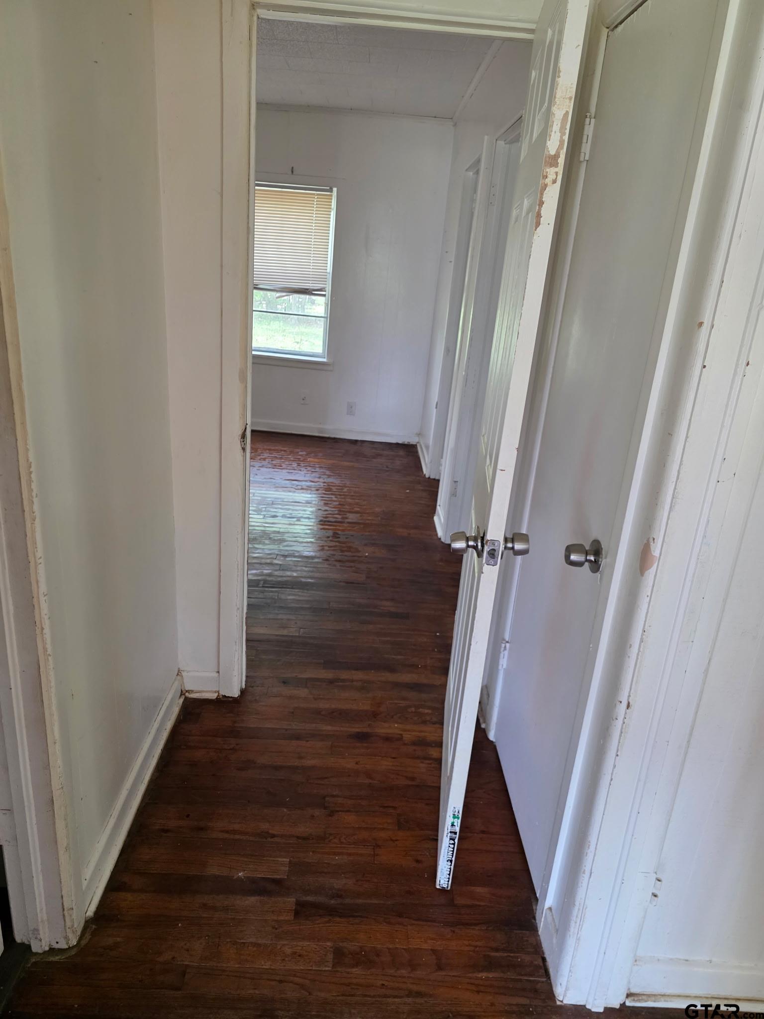 312 5th Street Southwest Bogata, TX 75417 - Photo 9 of 9 a view of a hallway with wooden floor and staircase
