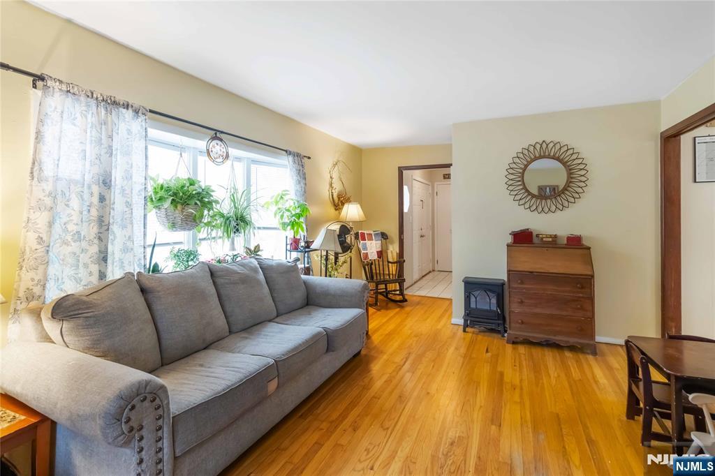 175 Highland Lakes Road Vernon, NJ 07422 - Photo 11 of 50 a living room with furniture and a wooden floor