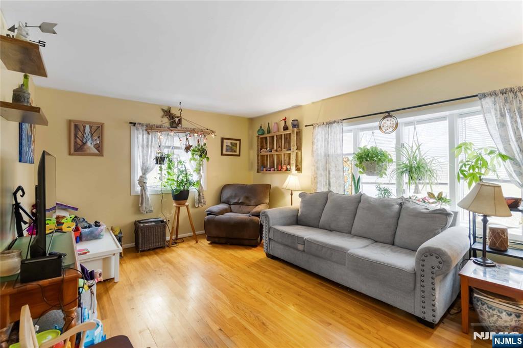 175 Highland Lakes Road Vernon, NJ 07422 - Photo 12 of 50 a living room with furniture and a large window