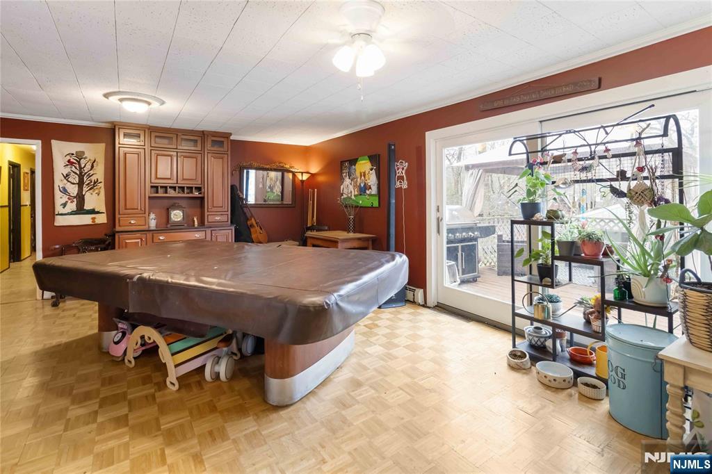 175 Highland Lakes Road Vernon, NJ 07422 - Photo 17 of 50 a room with furniture pool table and glass windows