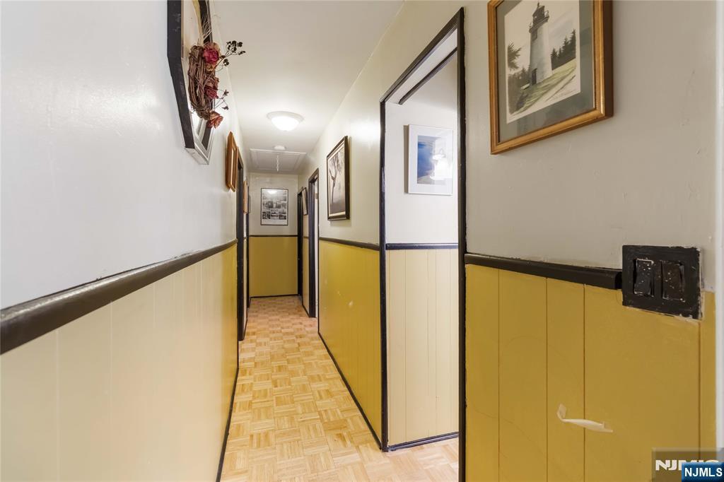175 Highland Lakes Road Vernon, NJ 07422 - Photo 21 of 50 a view of a hallway with paintings on the wall