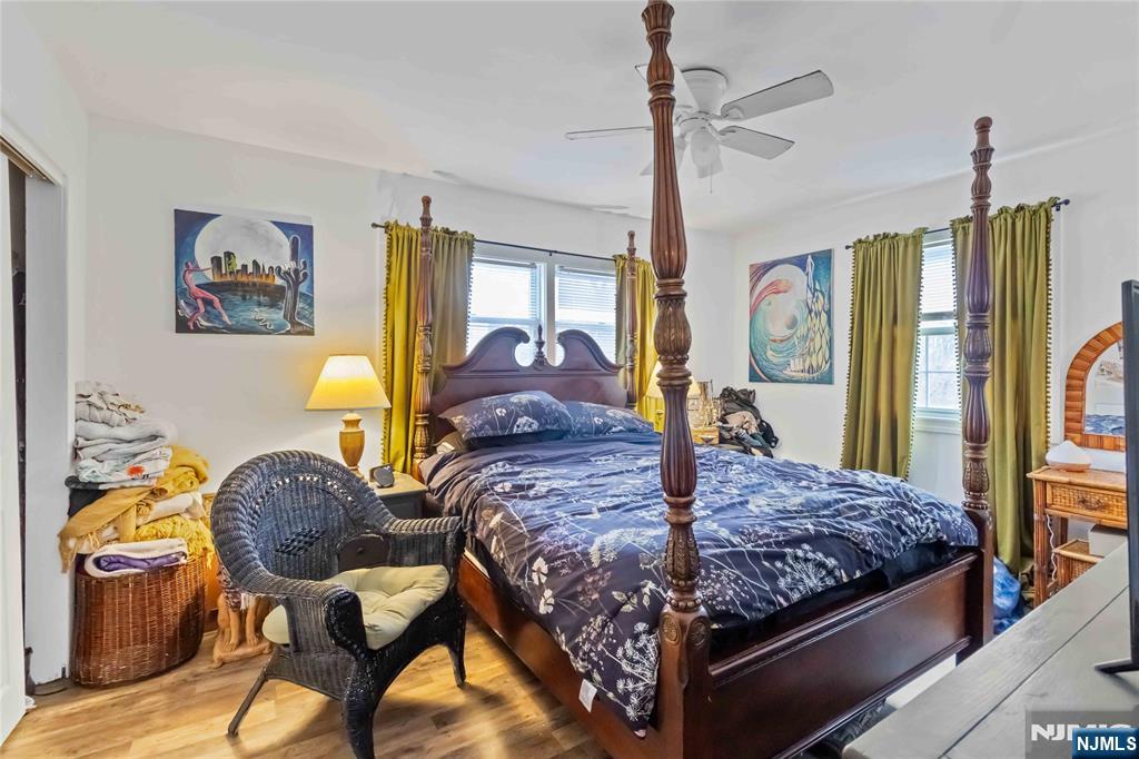 175 Highland Lakes Road Vernon, NJ 07422 - Photo 25 of 50 a bedroom with a bed dresser and window