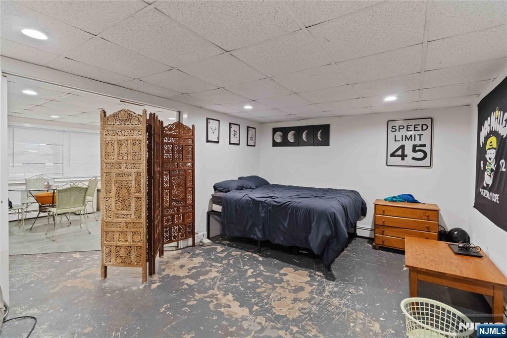 175 Highland Lakes Road Vernon, NJ 07422 - Photo 28 of 50 a spacious bedroom with a bed and a walk in closet