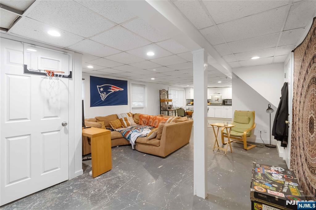 175 Highland Lakes Road Vernon, NJ 07422 - Photo 32 of 50 a living room with furniture and a flat screen tv