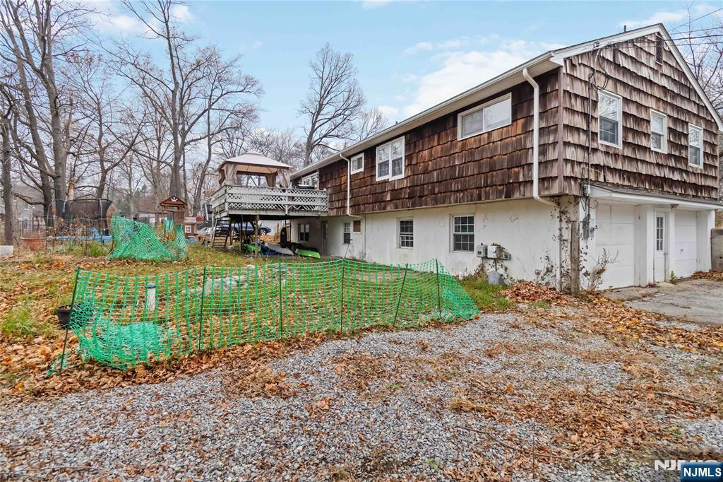 175 Highland Lakes Road Vernon, NJ 07422 - Photo 38 of 50 a front view of a house with garden