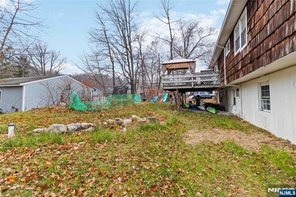 175 Highland Lakes Road Vernon, NJ 07422 - Photo 39 of 50 a view of a house with a yard
