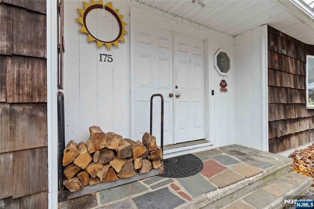 175 Highland Lakes Road Vernon, NJ 07422 - Photo 4 of 50 a bedroom with a bed and a book shelf