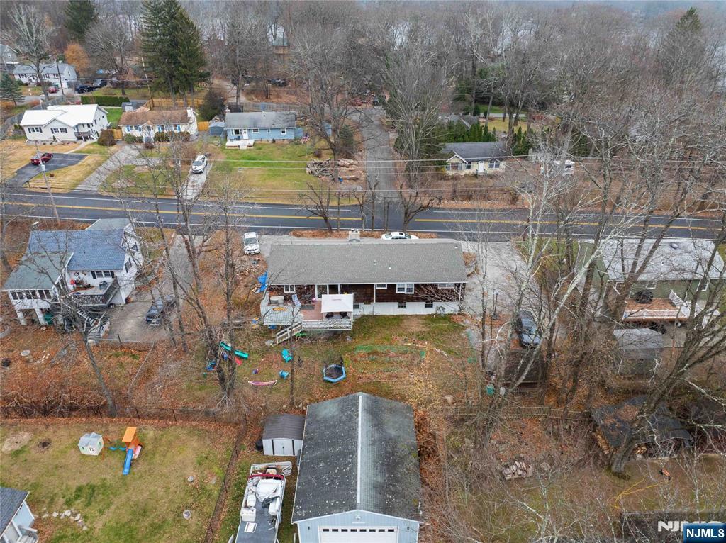 175 Highland Lakes Road Vernon, NJ 07422 - Photo 47 of 50 a aerial view of a house with a swimming pool