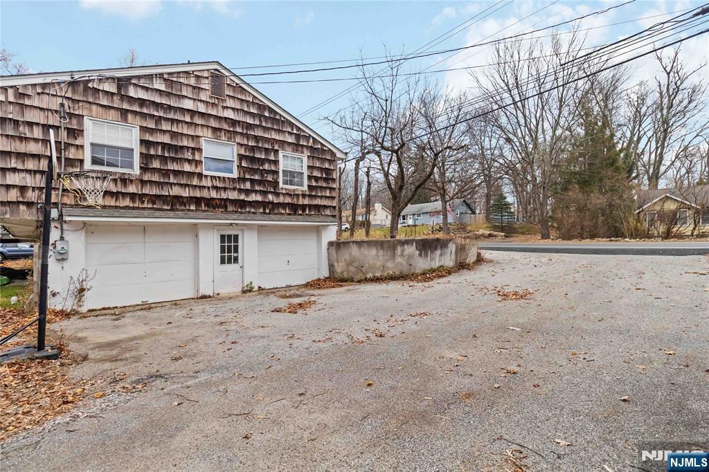 175 Highland Lakes Road Vernon, NJ 07422 - Photo 6 of 50 a front view of a house with a yard