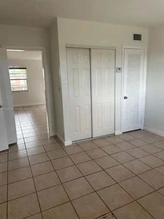 a view of a livingroom and entryway
