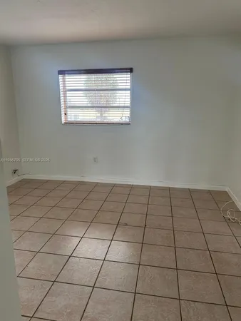 a view of a window and an empty room