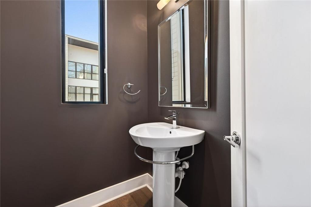 105 Birch Street Decatur, GA 30030 - Photo 15 of 31 a bathroom with a sink a mirror and a window