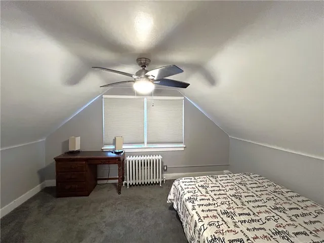 a bedroom with a bed and dresser