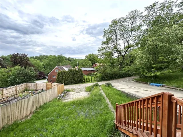 a view of street from deck and yard
