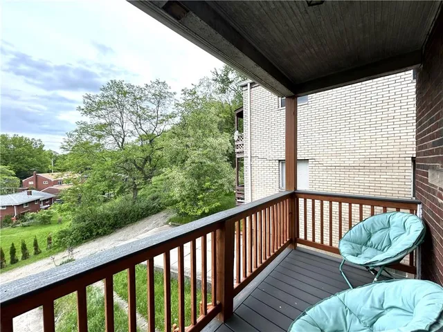 a view of a chair in a balcony