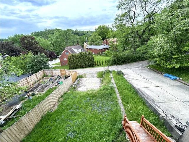 a view of a garden with a yard