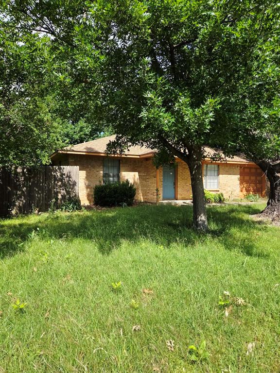 722 South Church Street Pilot Point, TX 76258 - Photo 25 of 37 a front view of a house with garden