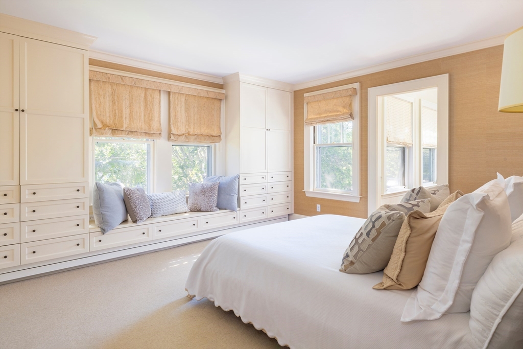 26 Dorset Road Newton, MA 02468 - Photo 11 of 22 a bedroom with a bed and a large window